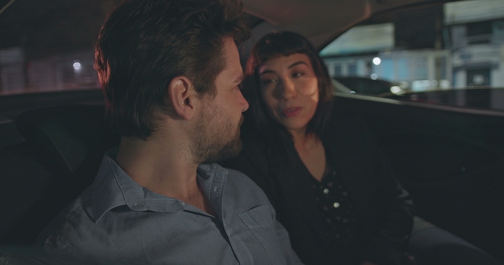 Couple in taxi at night