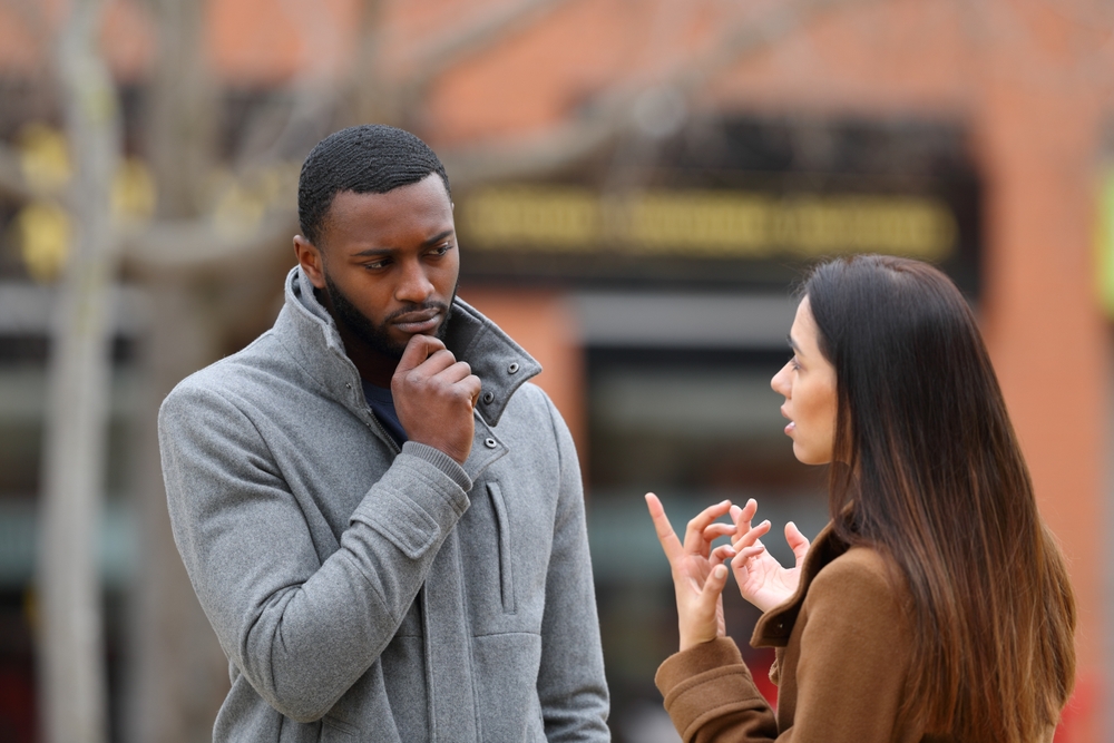 Couple speaking outside in winter time