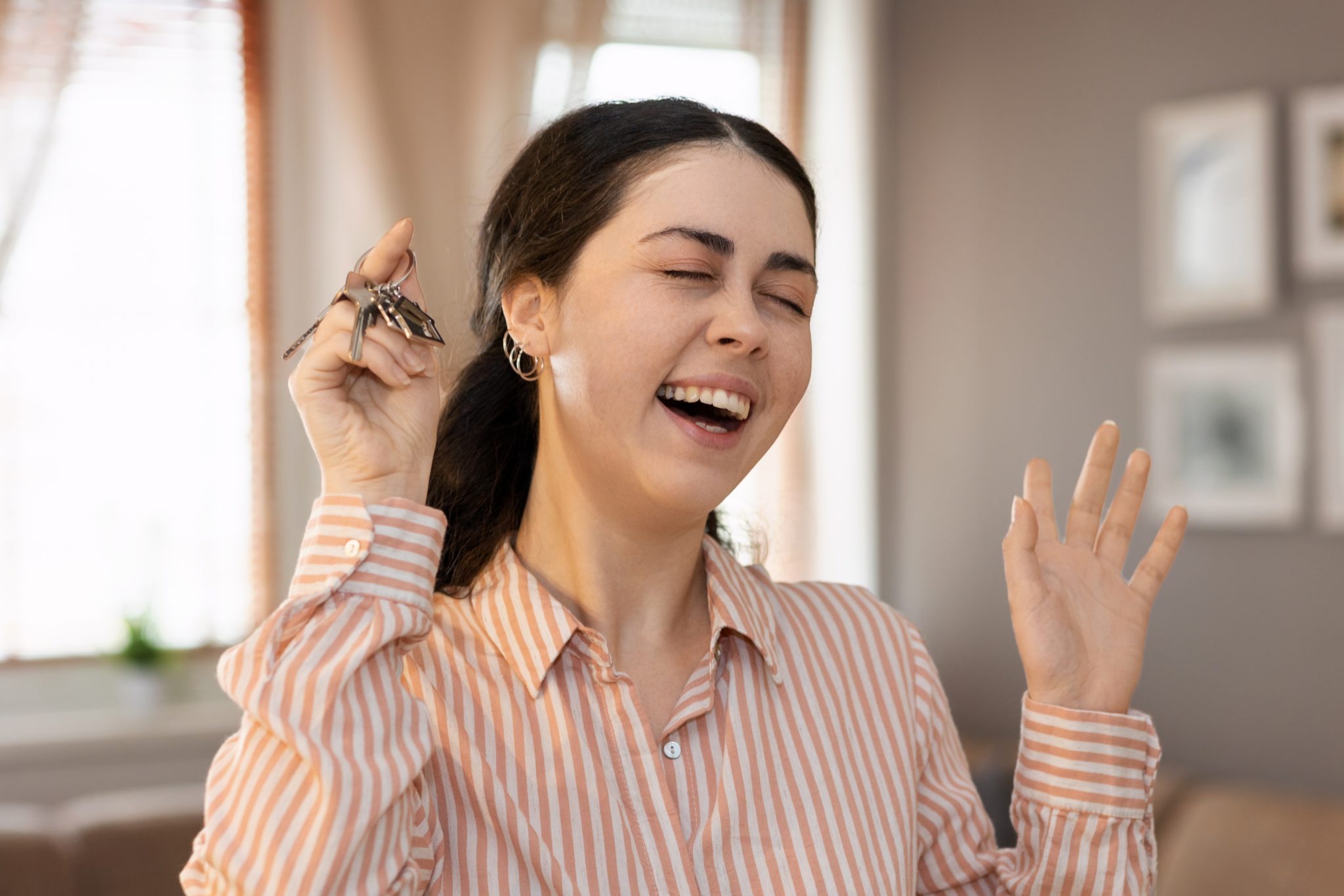 woman holding a keychain