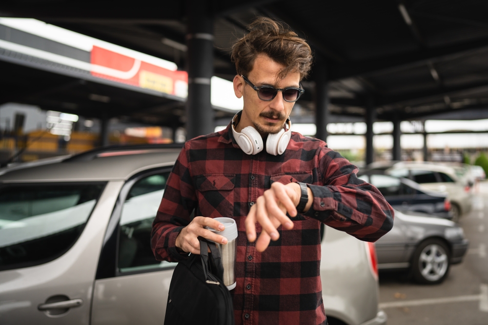 One man young adult caucasian male with mustaches standing at the parking lot