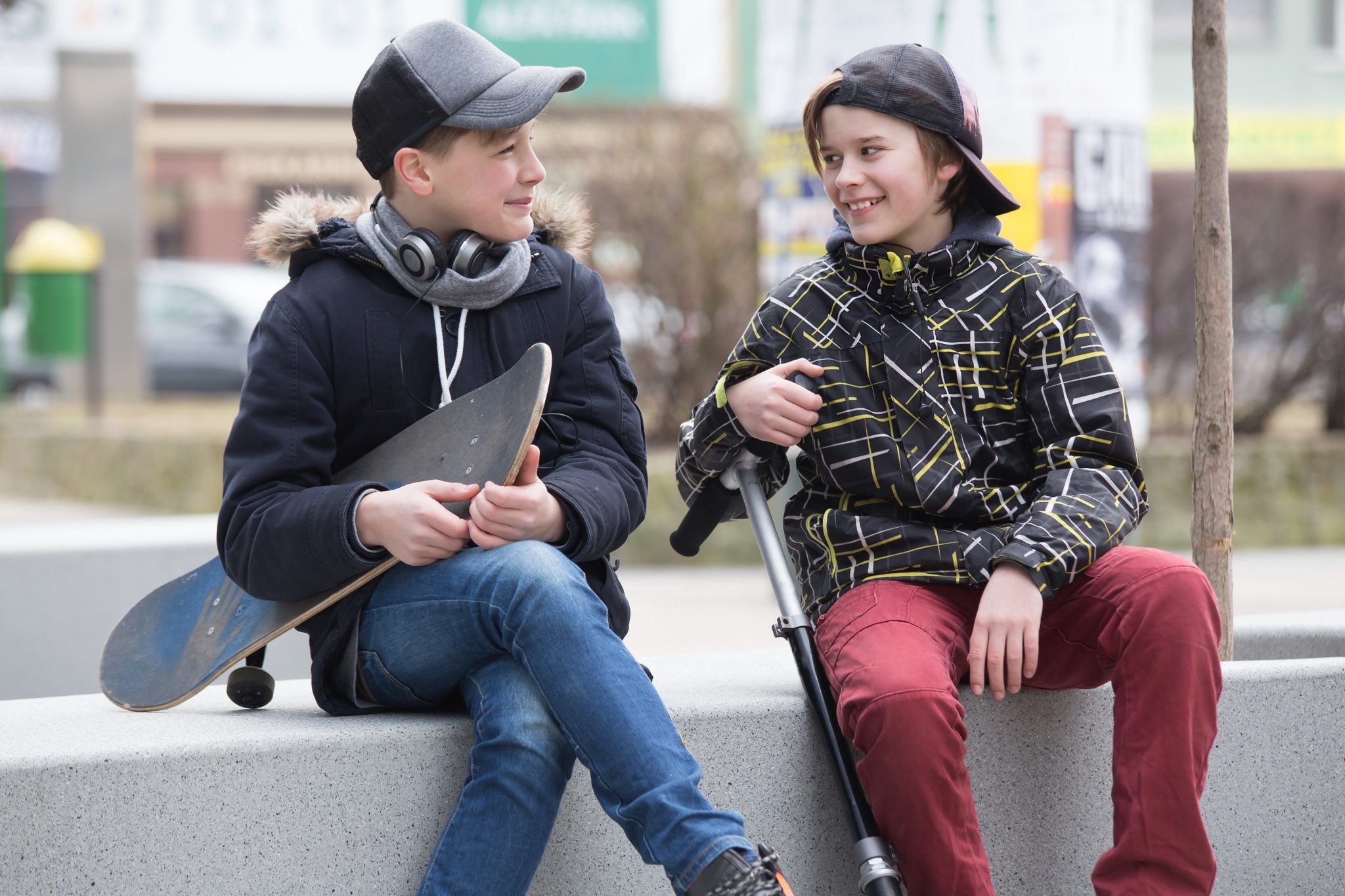 Two boys talking on the street