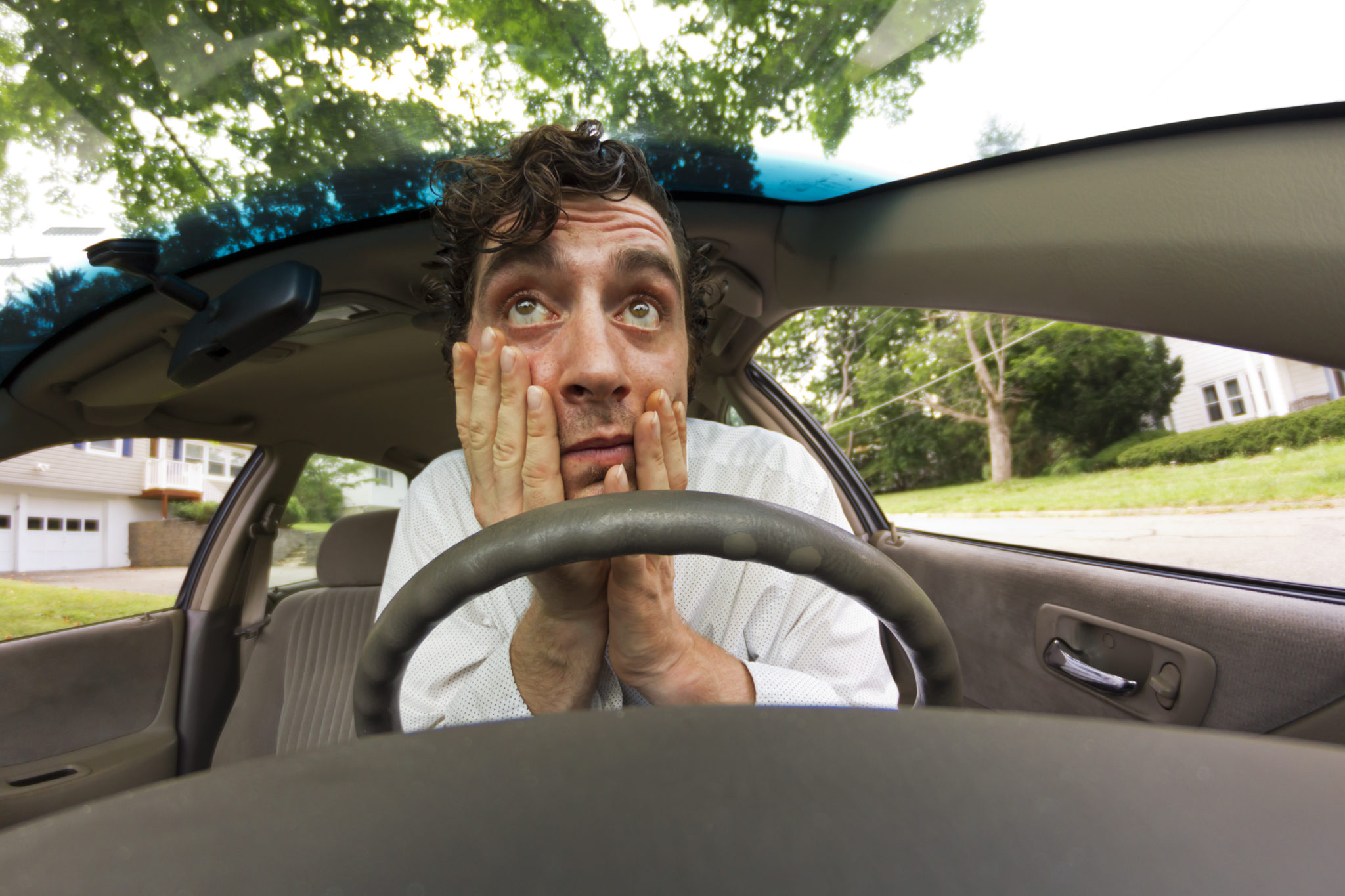 Scared man inside car