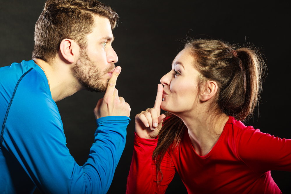 Couple keeping a secret