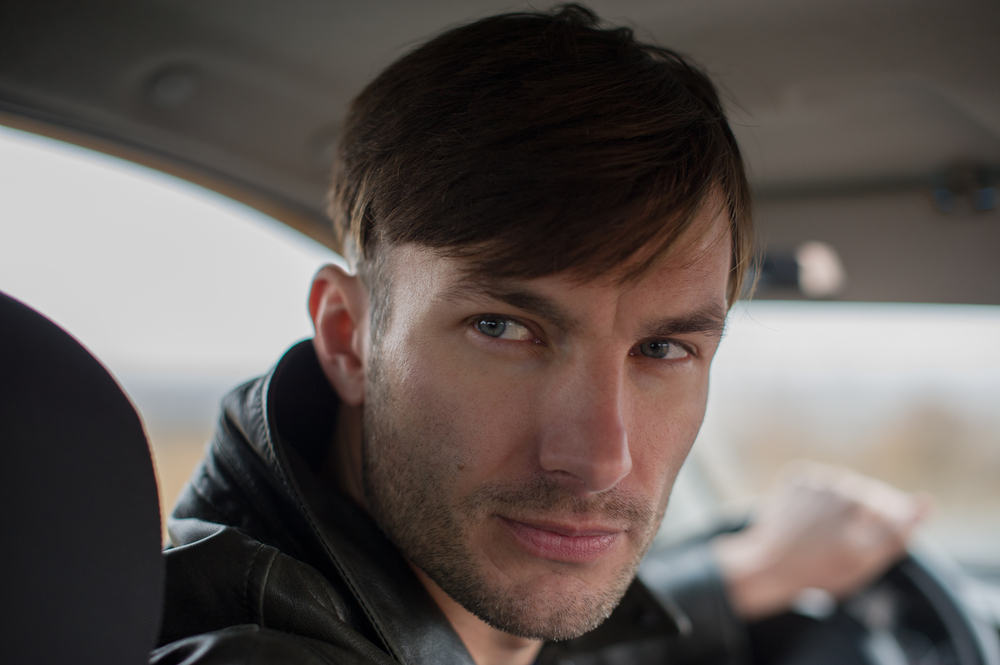 Man in a police car watching