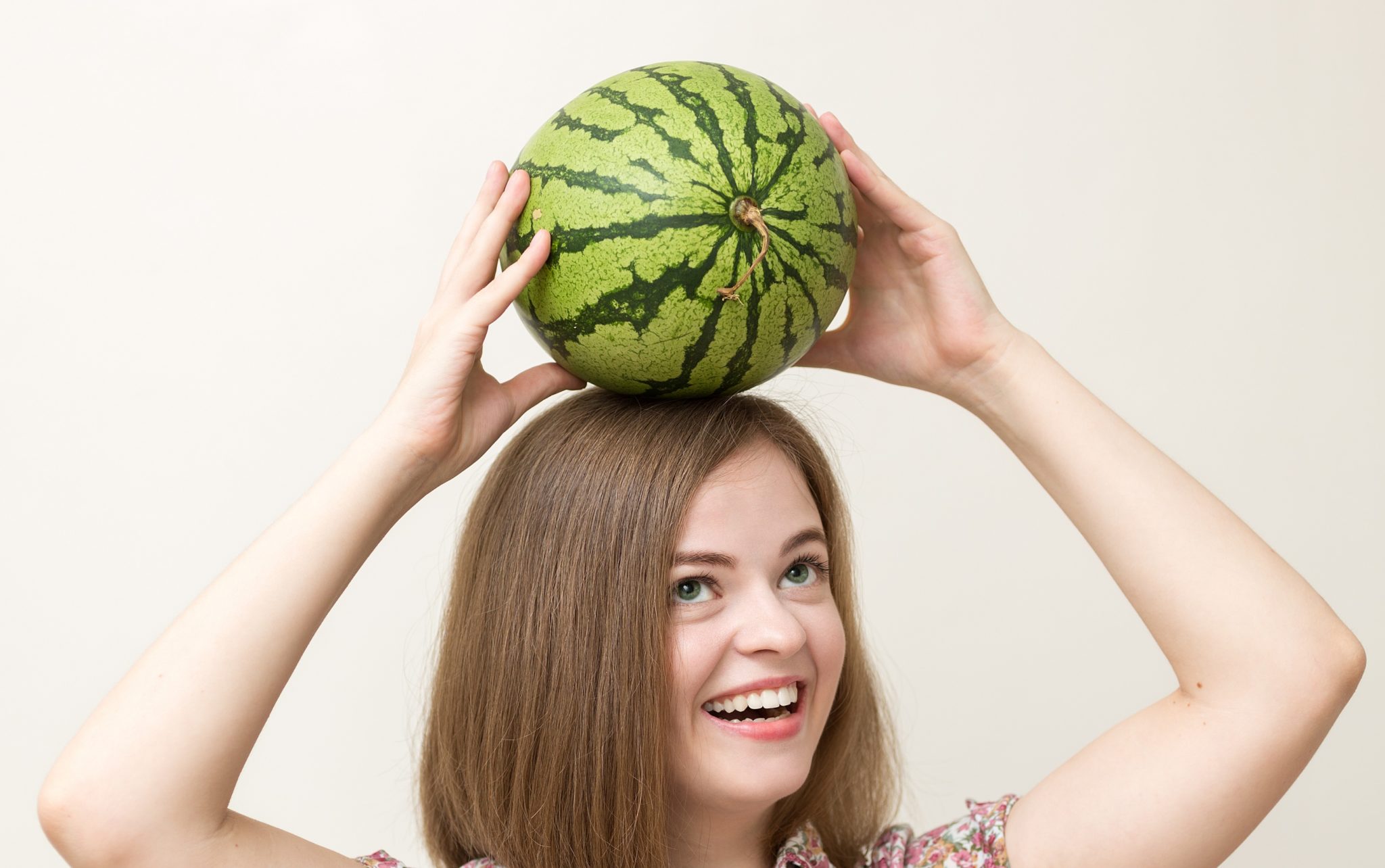 Woman with watermelon on her head
