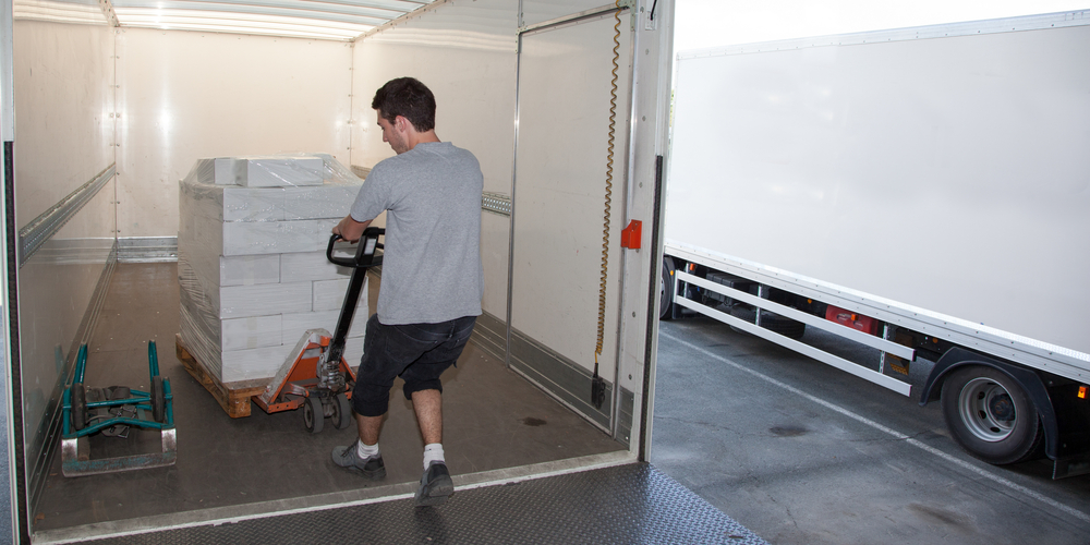 Truck driver empties his truck