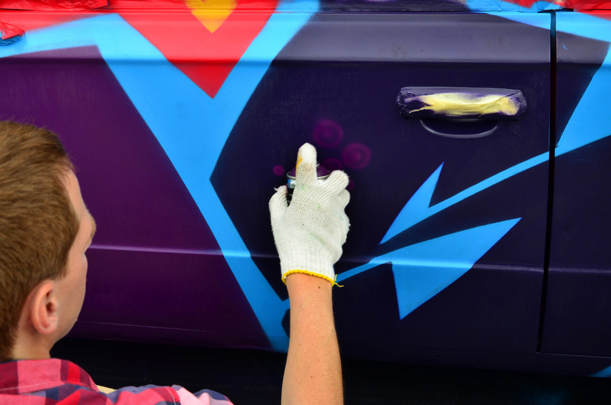 vandalizing a truck with spray paint