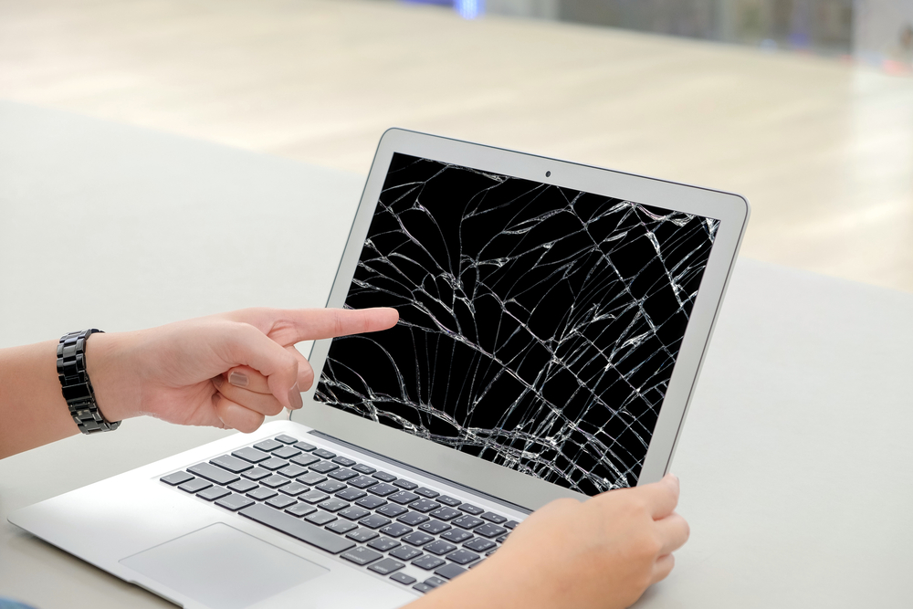 Pointing at broken laptop