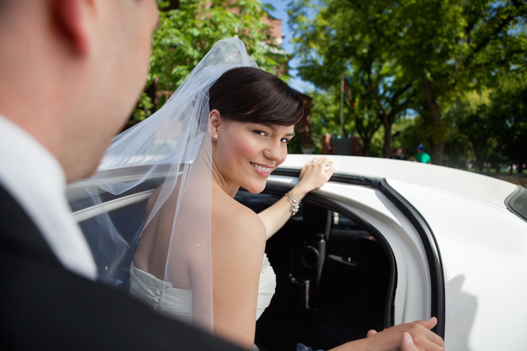 Bride getting in limo