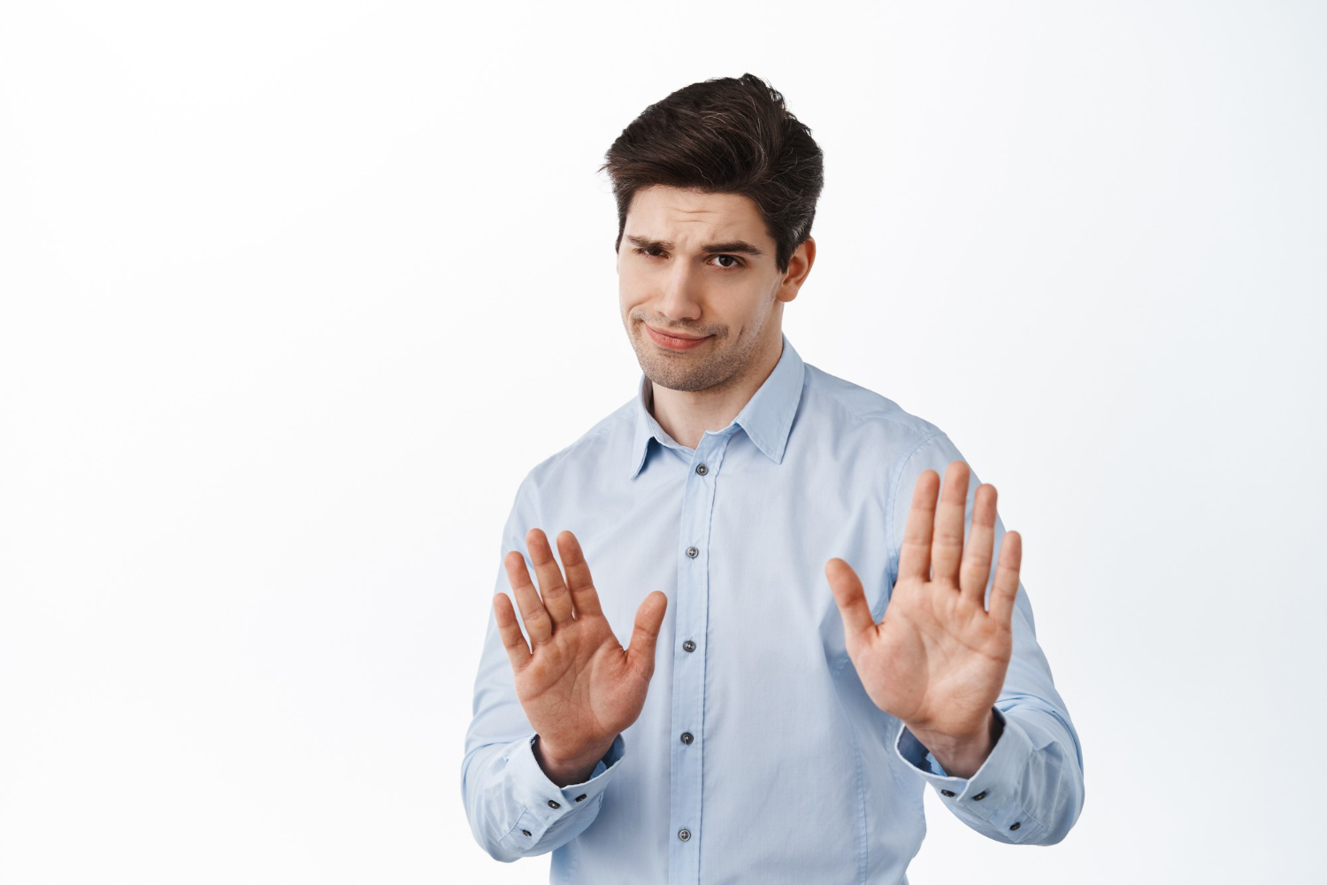 Man wearing light blue shirt making NO suggestion on a white background