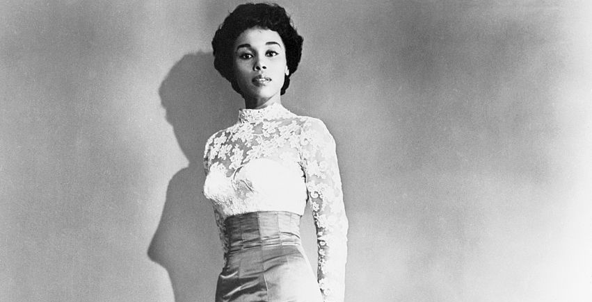 Portrait of the actress Diahann Carroll wearing white clothing