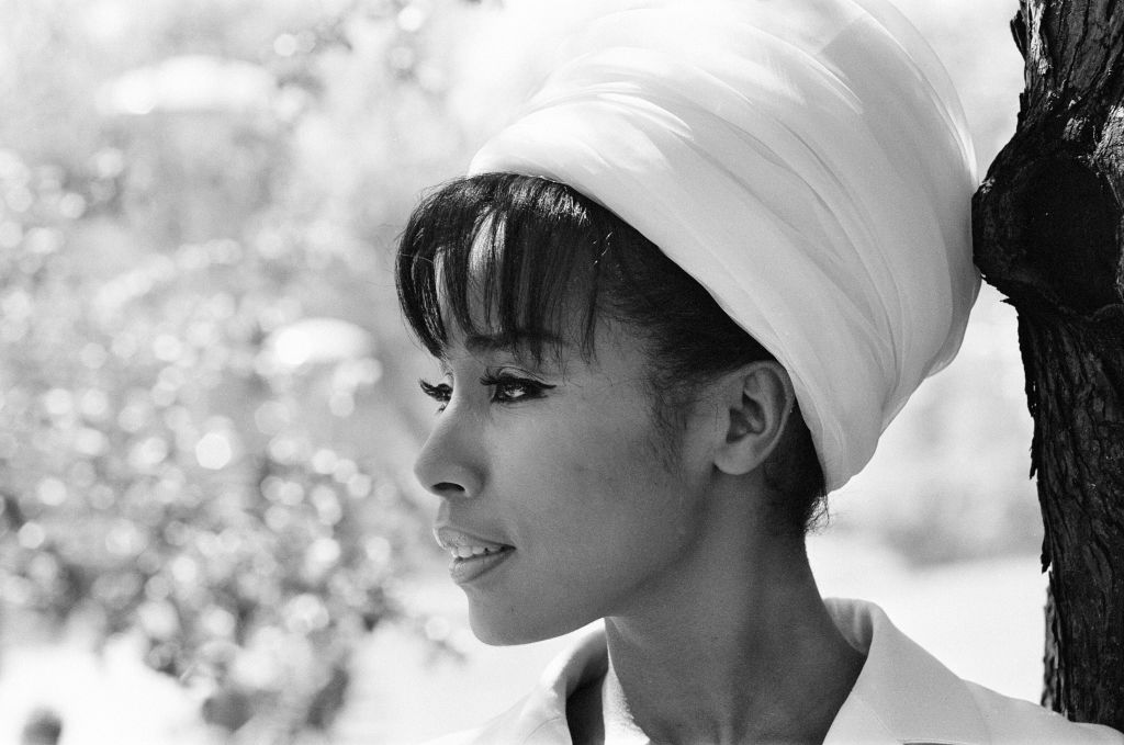 Profile Photo of the American Singer and Actress Diahann Carroll wearing a white hat