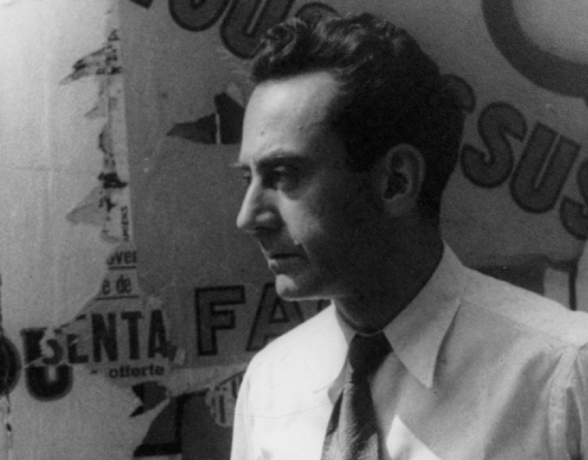 Man Ray looking at front in white shirt - 1934