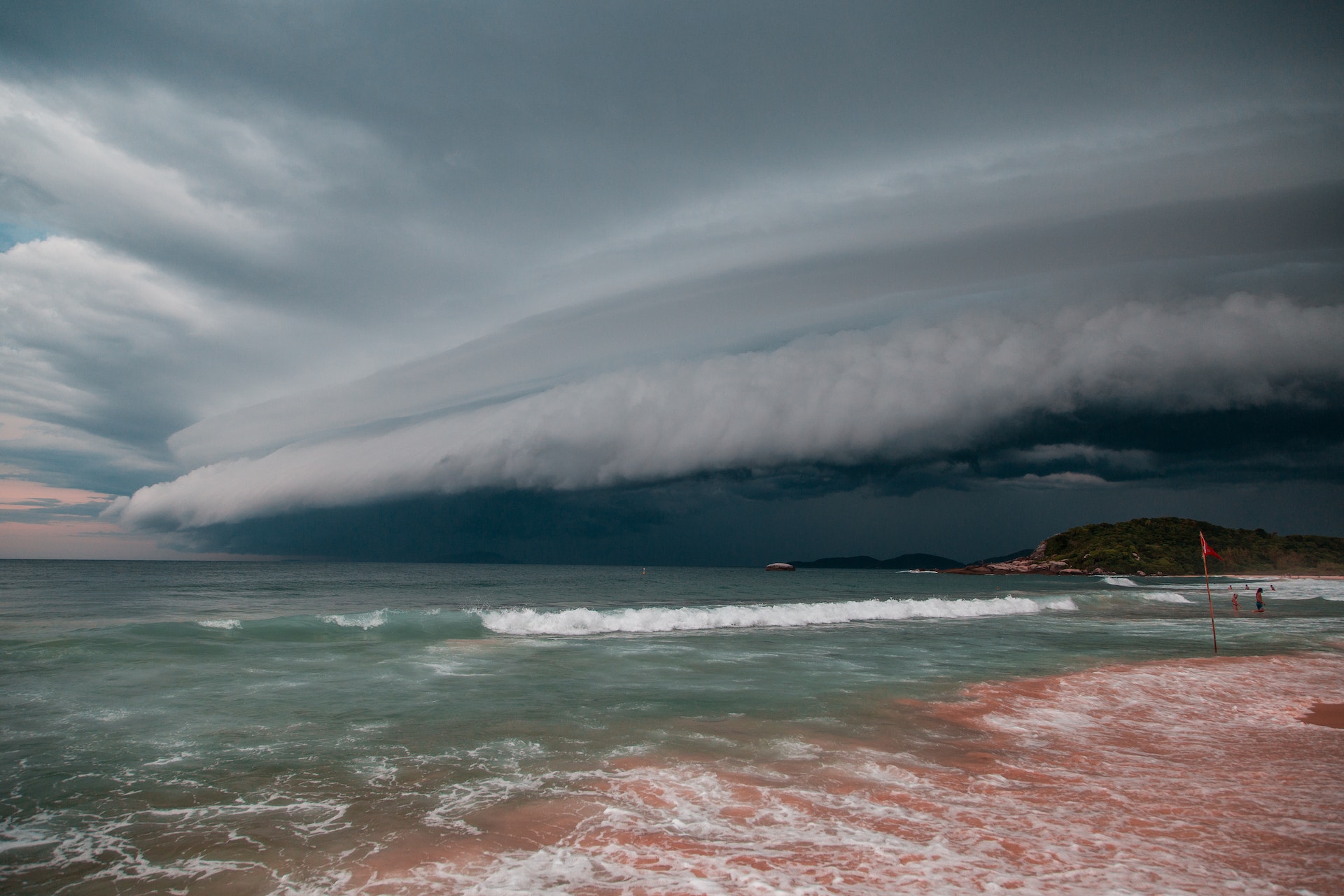 sea beach under white-gray dramatic sky