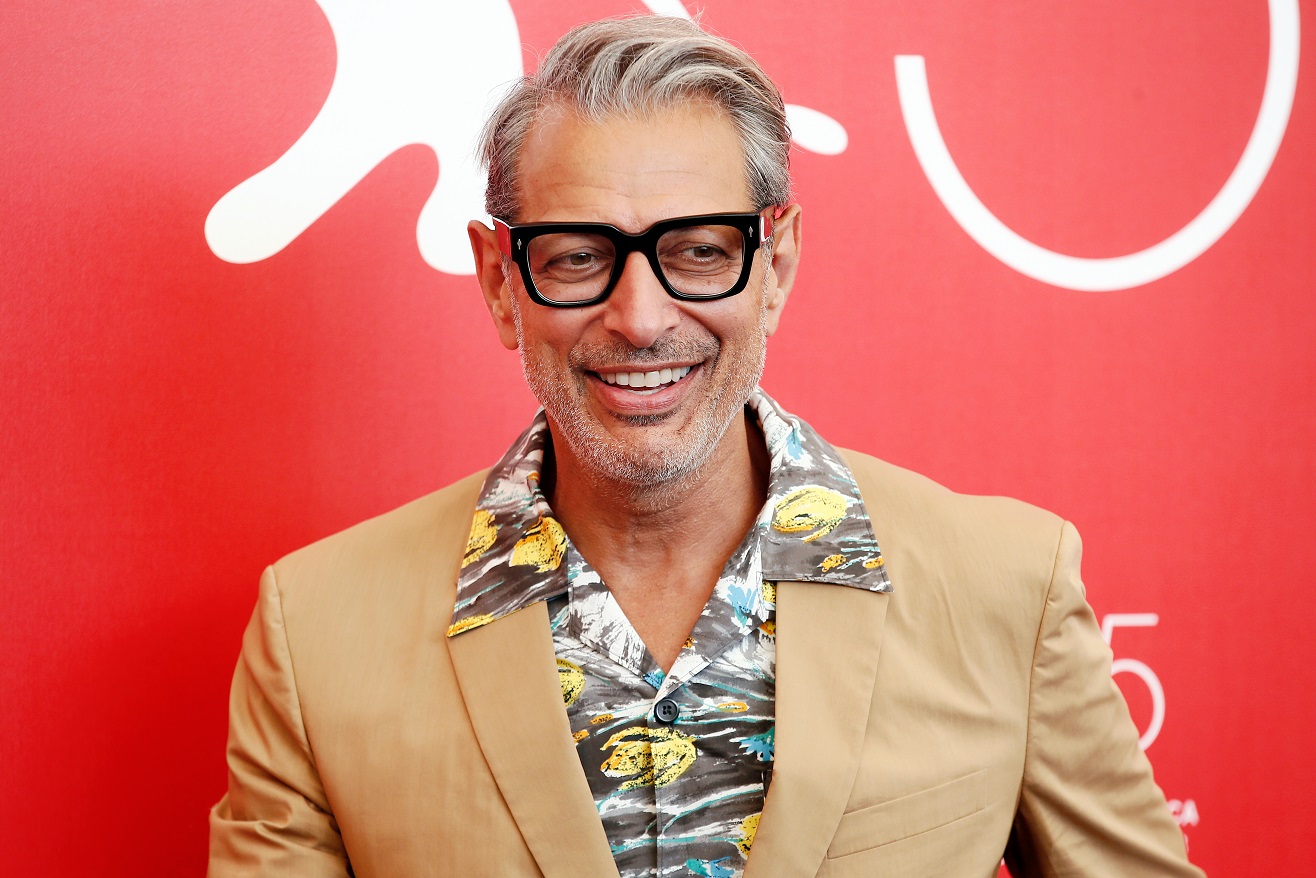 Jeff Goldblum in brown jacket is smiling at camera - 2018