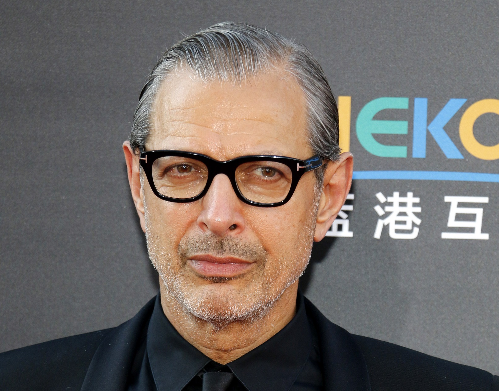 Jeff Goldblum in black suit is looking at side - 2016