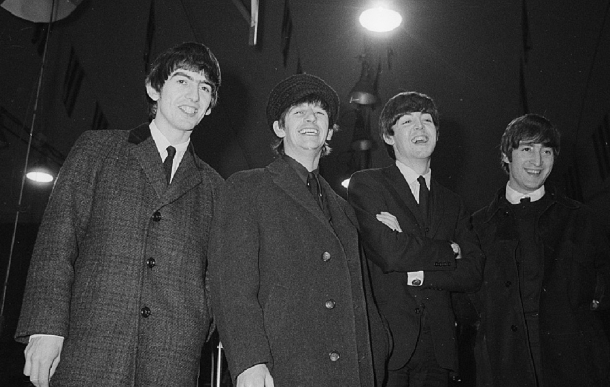 B&W photo of The Beatles at press conference - 1964