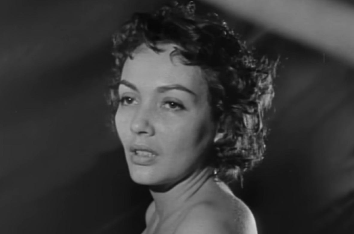 Screenshot: Susan Cabot with messy hair is looking at side with sad face - from Surrender - Hell! (1959)