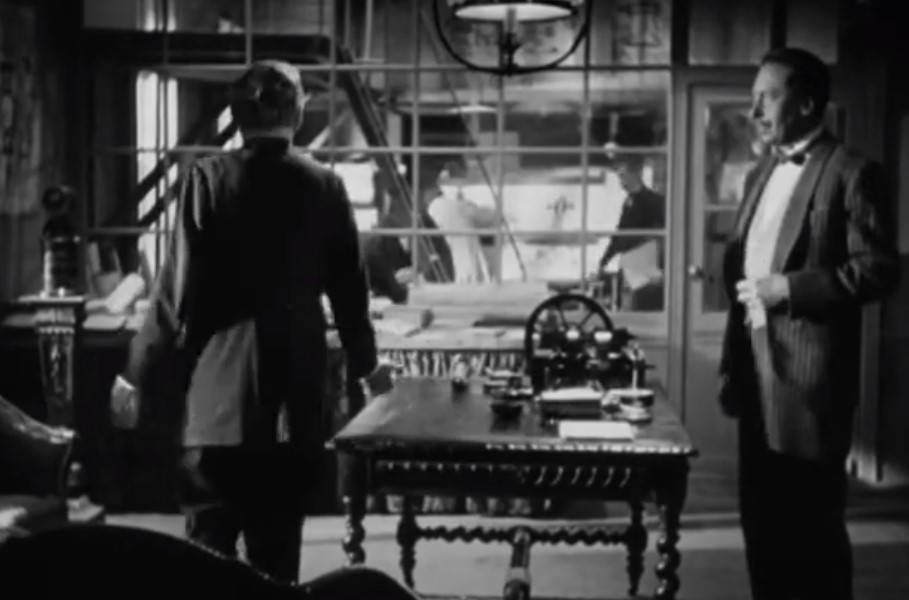 Willy Birgel  as diesel in movie in suit looking right 