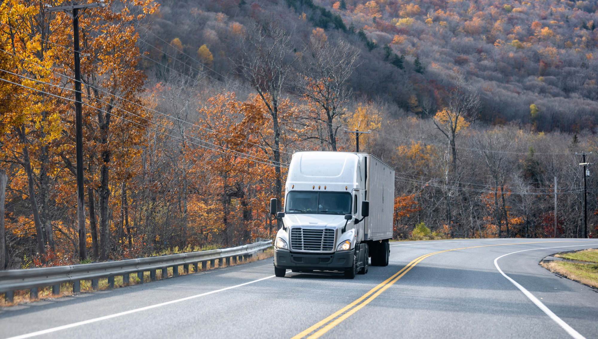 semi truck transporting cargo uphill