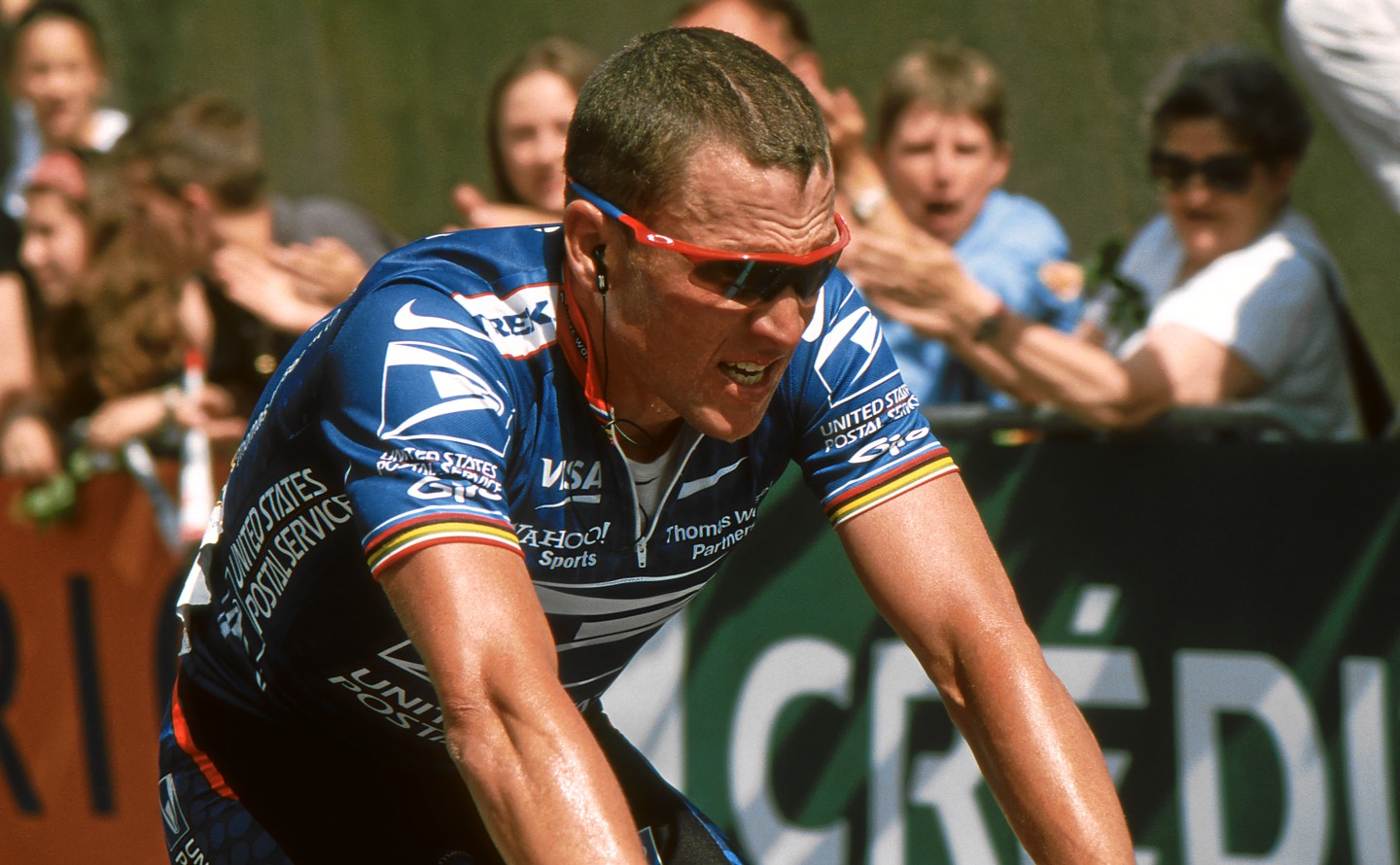 Lance Armstrong wearing blue shirt is cycling - 2002