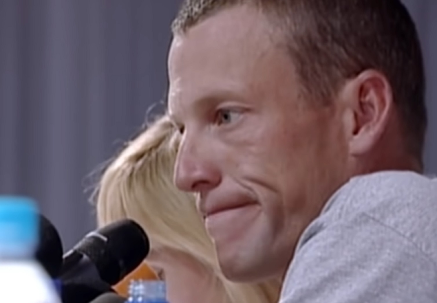 Screenshot: Lance Armstrong is looking at front with sad face  -from Stop At Nothing- The Lance Armstrong Story (2014)
