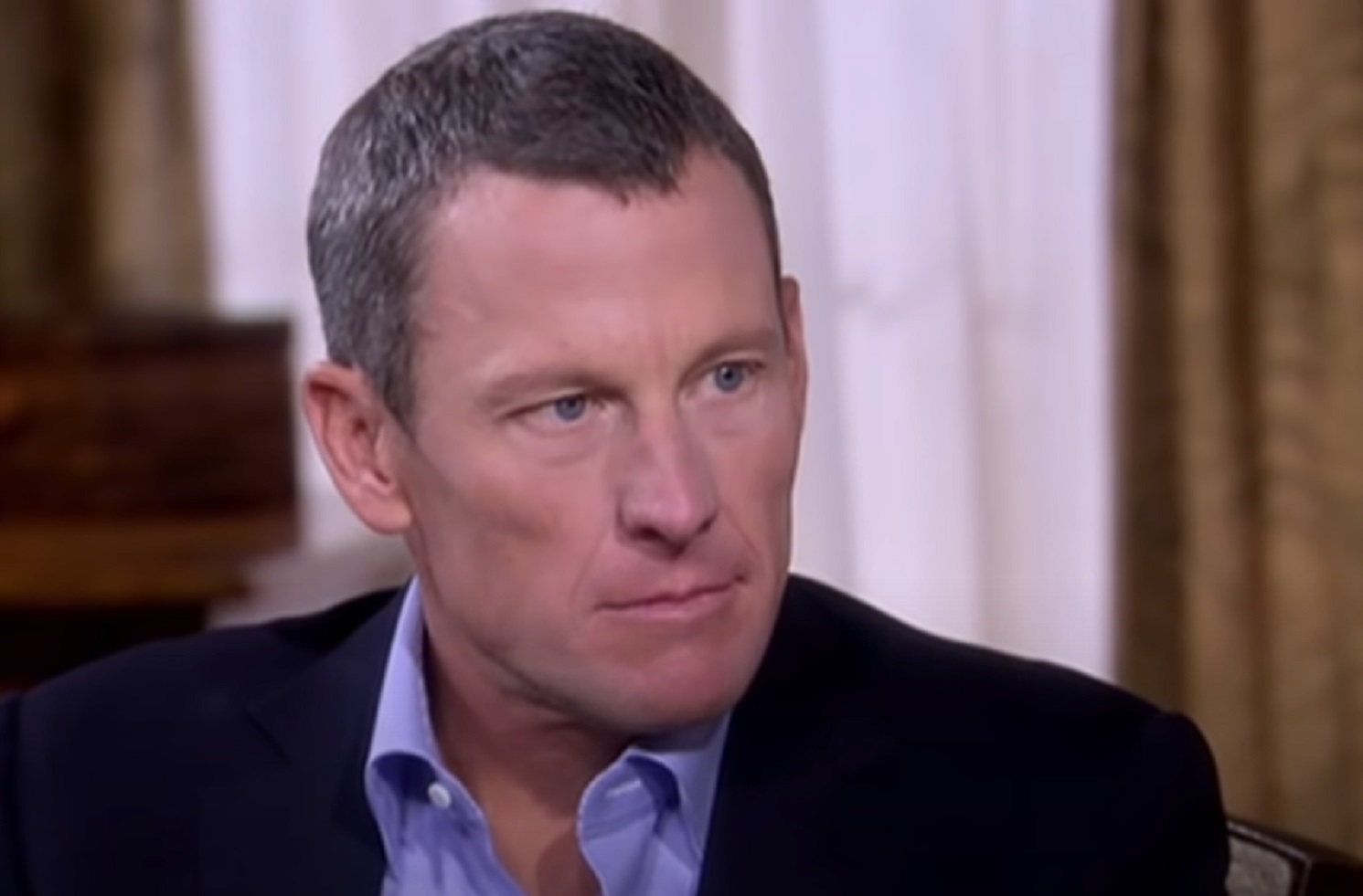Lance Armstrong wearing black jacket is looking at side -from Stop At Nothing- The Lance Armstrong Story (2014)