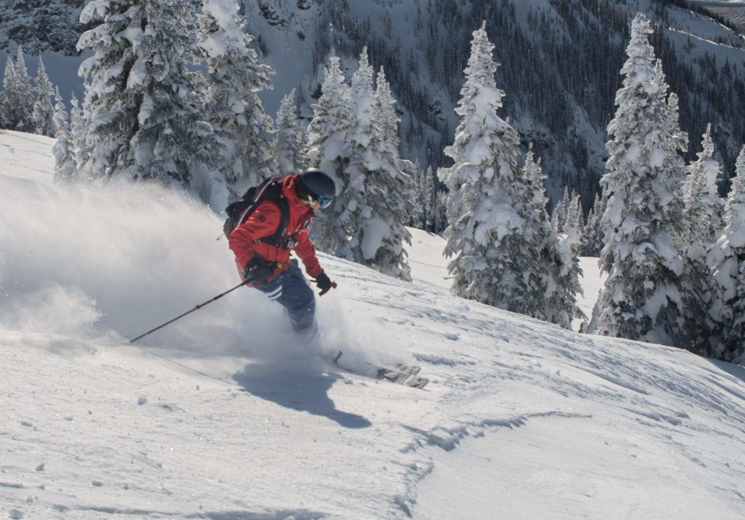 Man skiing in deep snow on the ,mountain