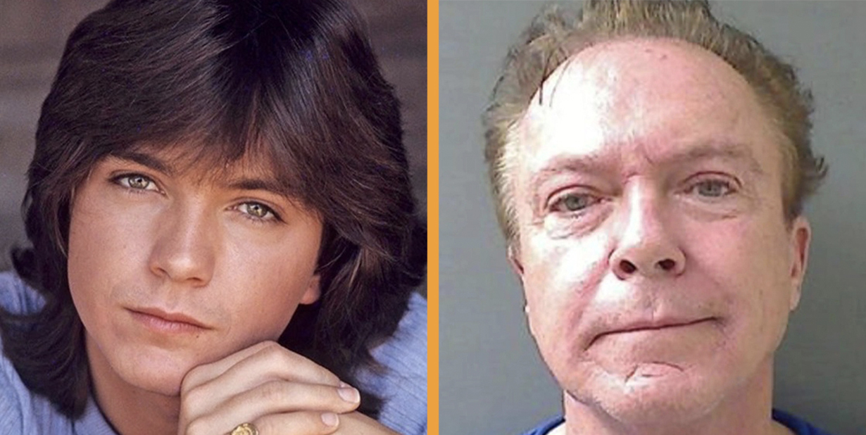 David Cassidy wearing black suit and white shirt is smiling and looking at side -  2004