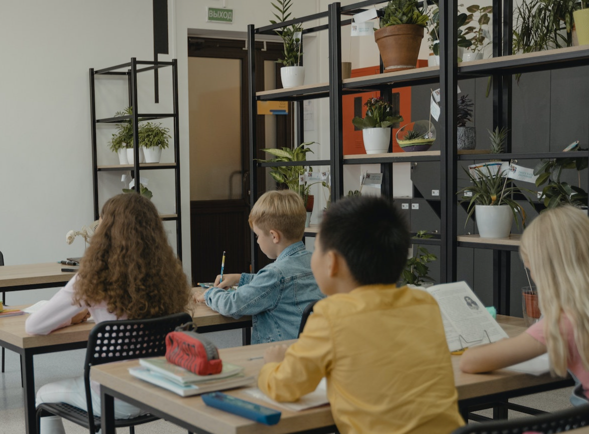 Teacher and students are in biology class in school.