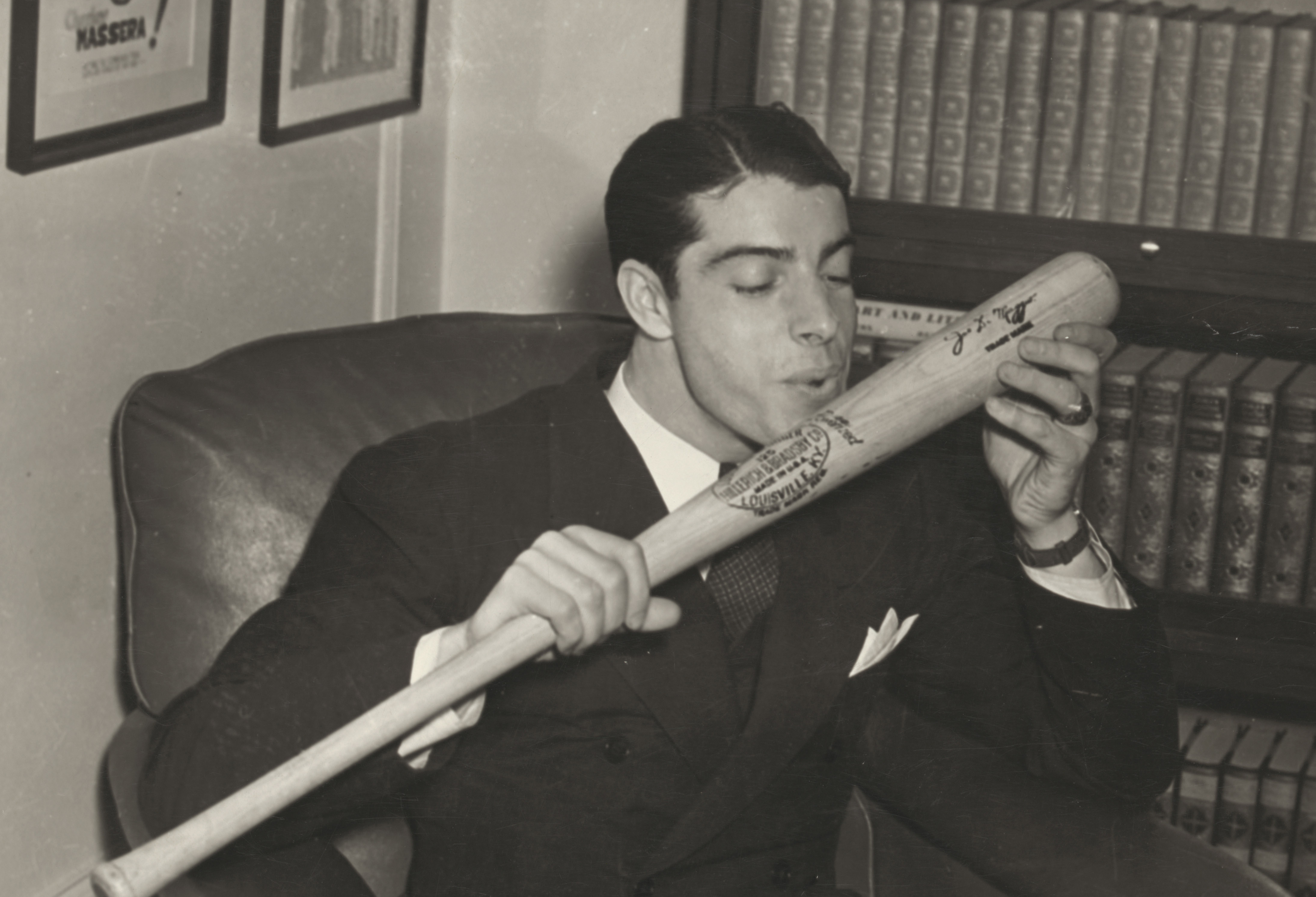 Joe DiMaggio salutes his bat