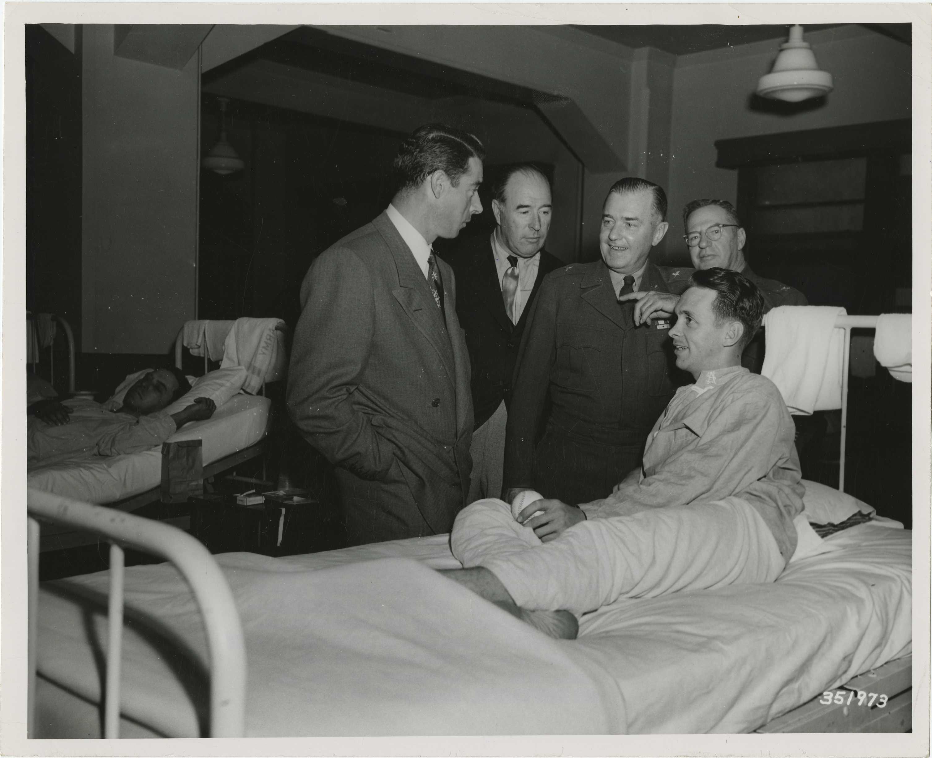 Joe DiMaggio and others stop to chat at the 155th Station Hospital