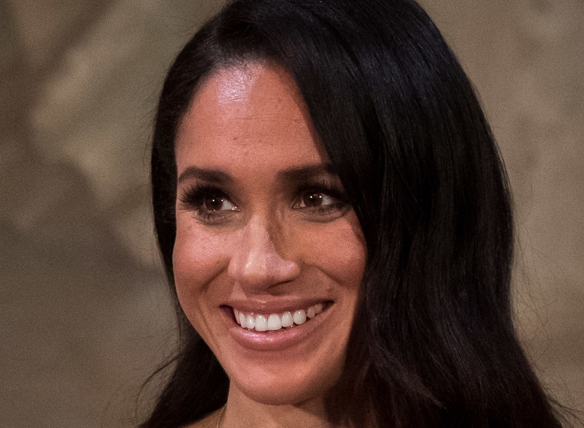 Meghan Markle smiling and looking at side - 2018
