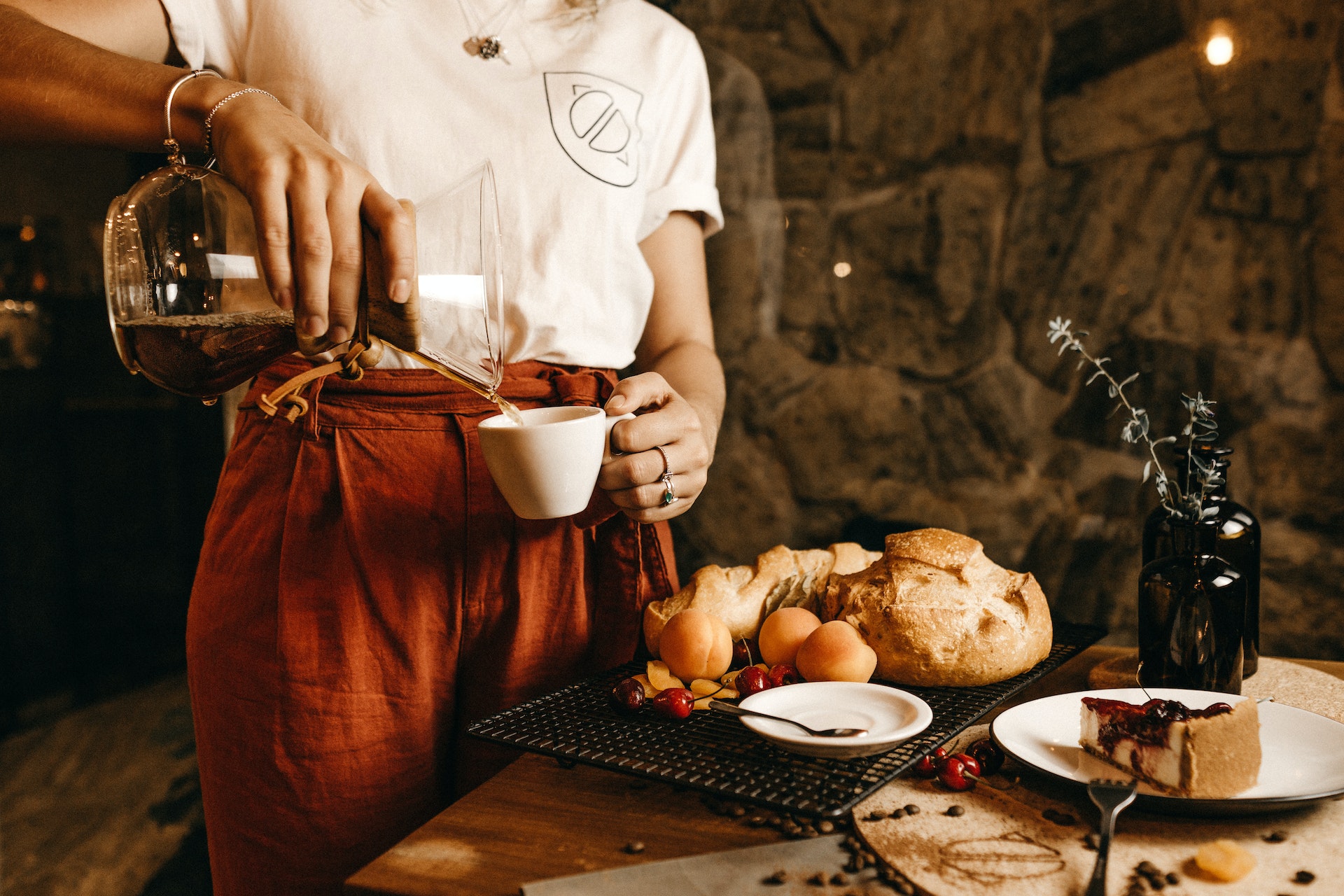 Waitress in white shirt serving food