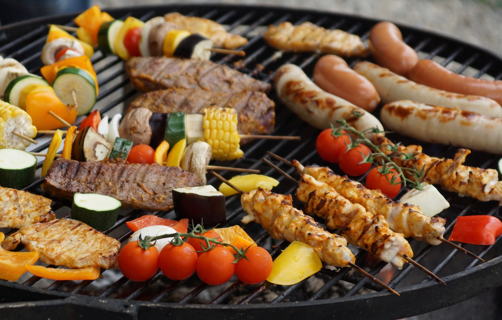 photo of a barbecue with meat beef vegetables