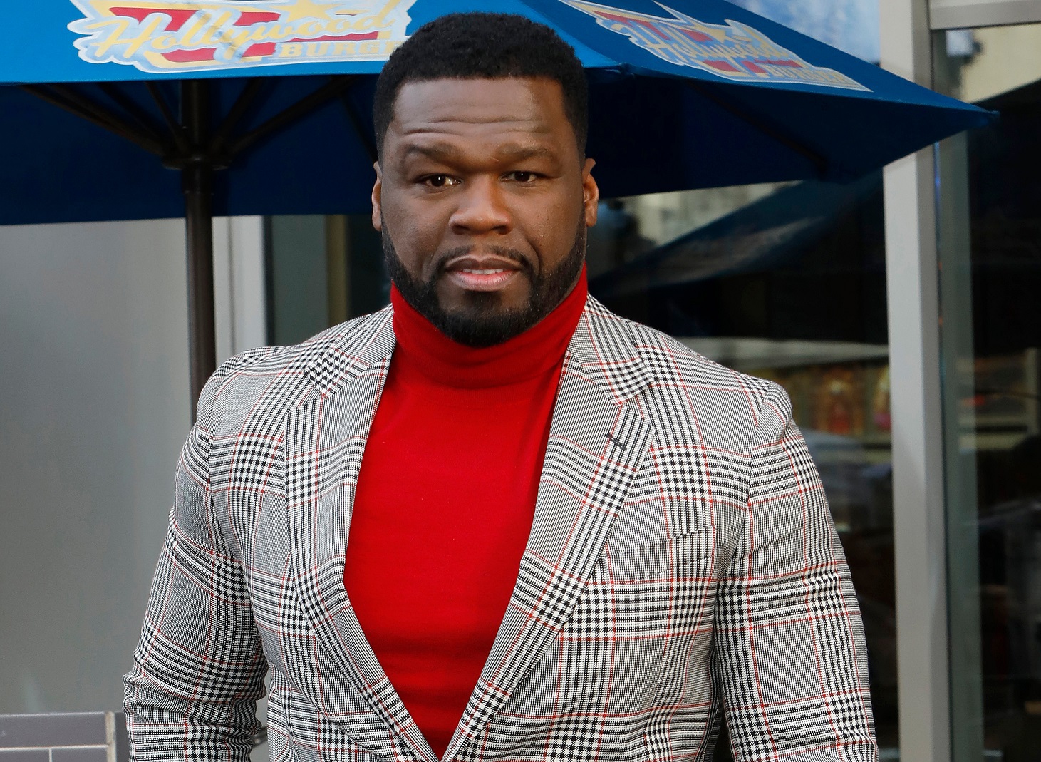 50 Cent on the Hollywood Walk of Fame wearing white blouse and grey jacket -  2019