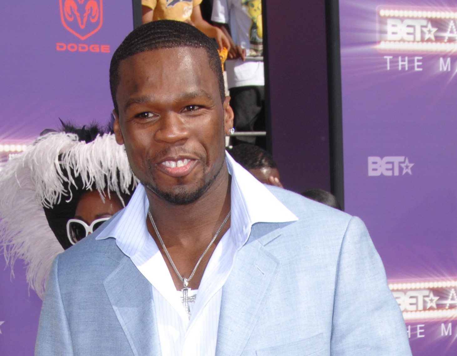 50 Cent wearing white shirt and blue jacket smiling - 2007