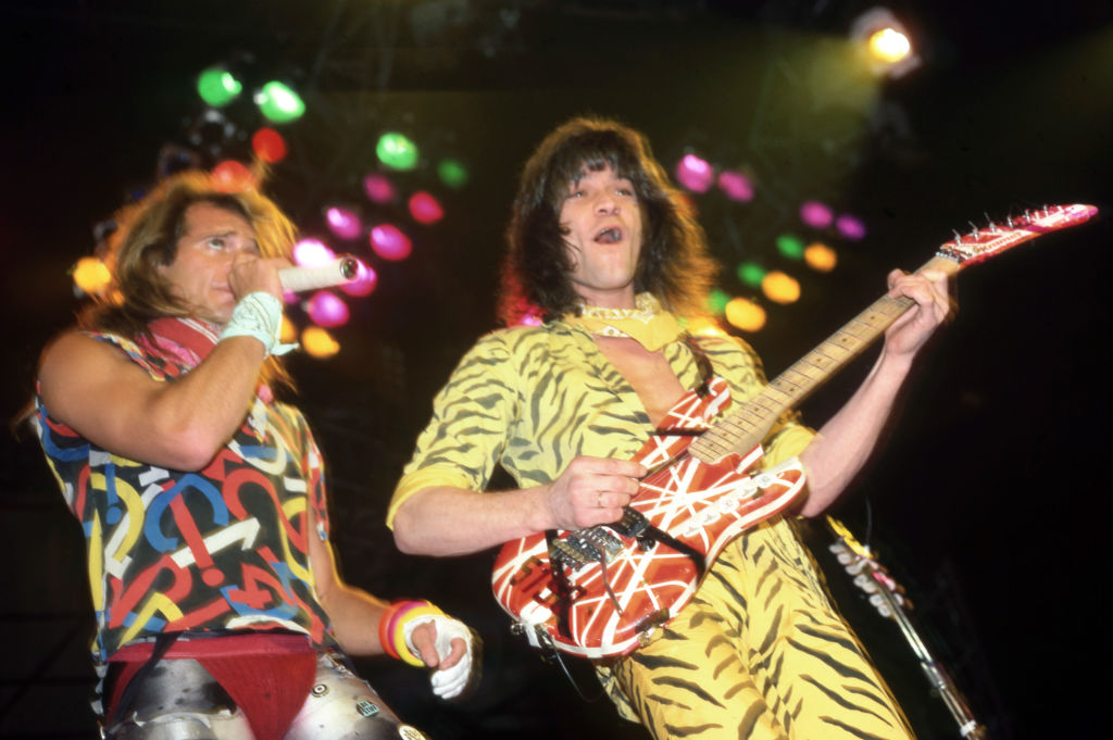 American rock vocalist David Lee Roth and American musician, songwriter, producer, and inventor Eddie Van Halen perform