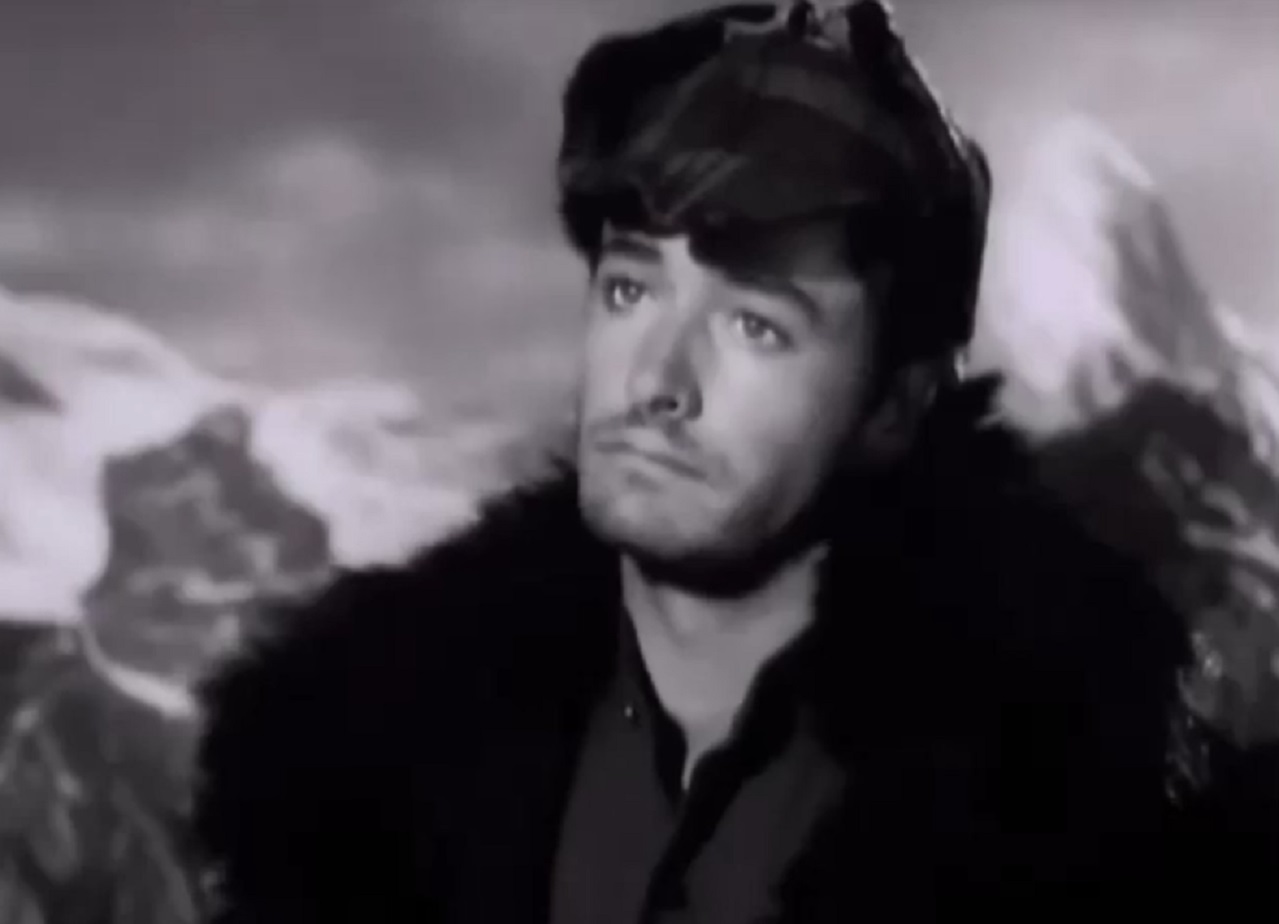 Screenshot - John Derek wearing coat and hat - from High Hell (1958)