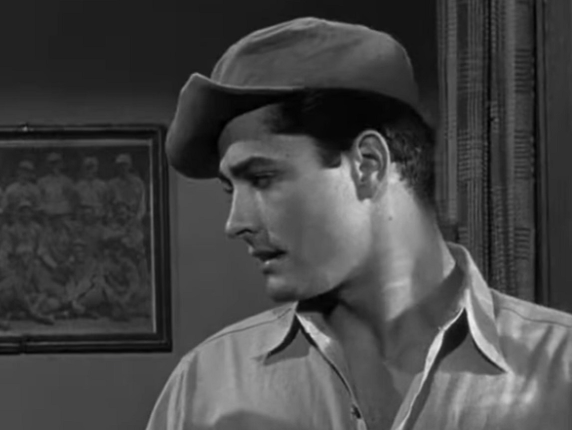 Screenshot of John Derek wearing jail uniform - from Knock on Any Door (1949)