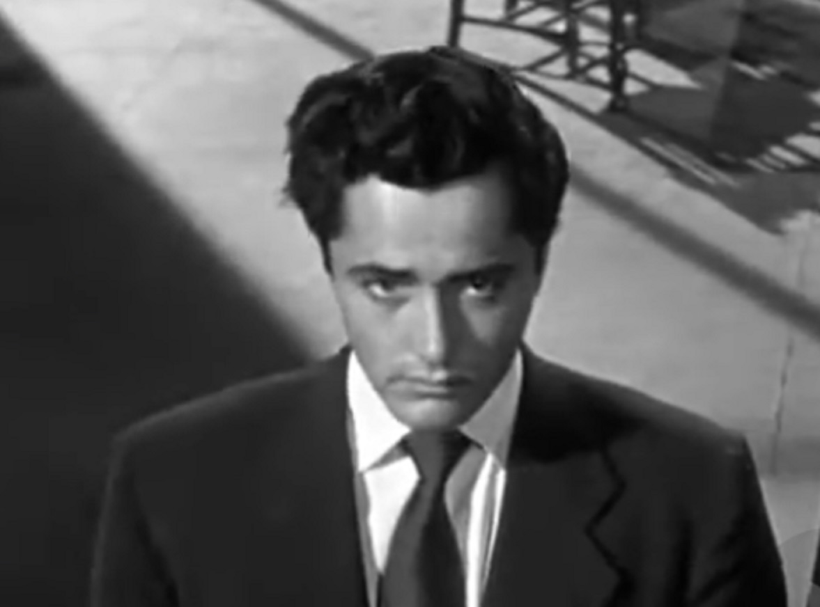 Screenshot of John Derek wearing suit and tie - from Knock On Any Door (1949)