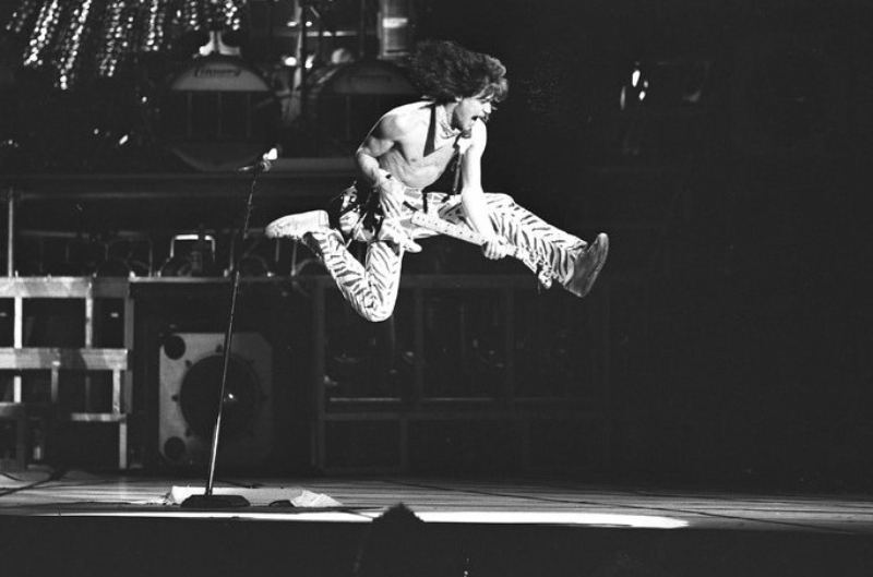 guitarist Eddie Van Halen airborne during performance