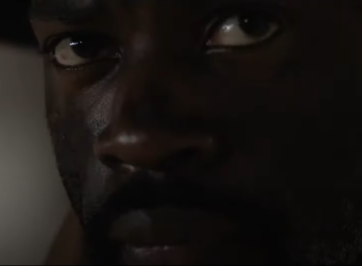 Screenshot: Bass Reeves close up face in dark - from H.e.l.l on the Border (2019)