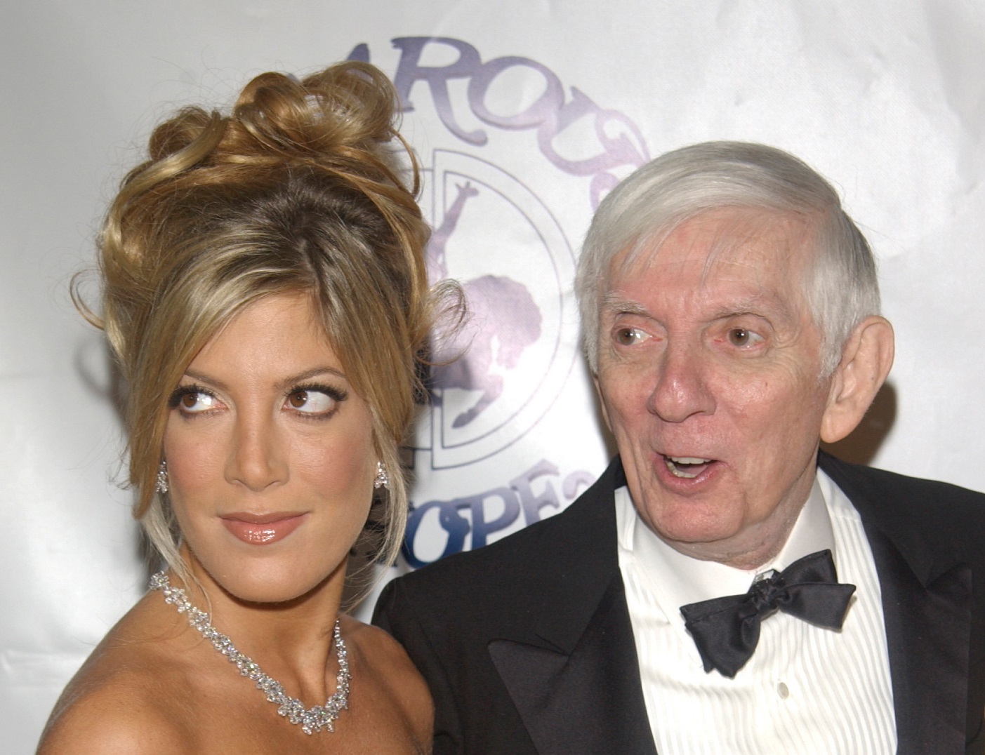 Tori Spelling and Aaron Spelling looking at side - 2002