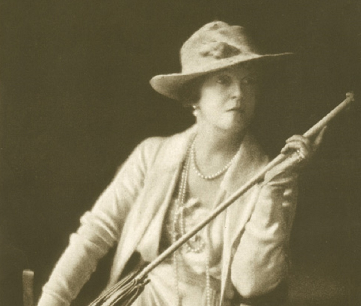 Lady Duff Gordon wearing white jacket and hat,looking at side - 1917