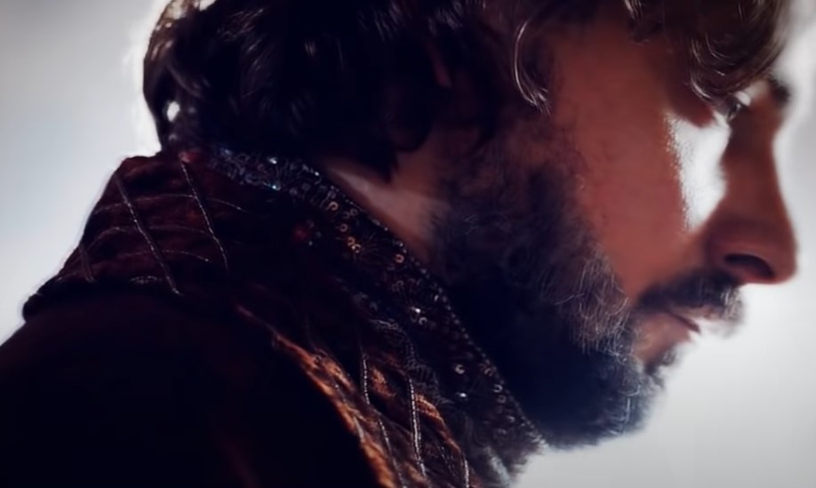 Ivan III of Russia, actor Evgeniy Tsyganov sitting on throne