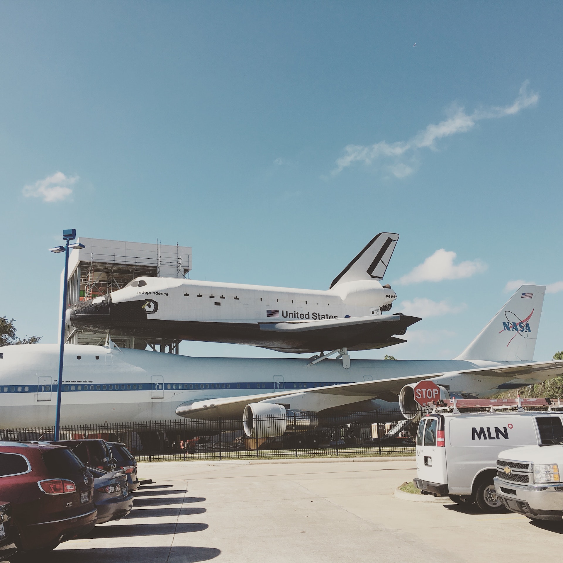 photo of gray airplane carrying a space shuttle