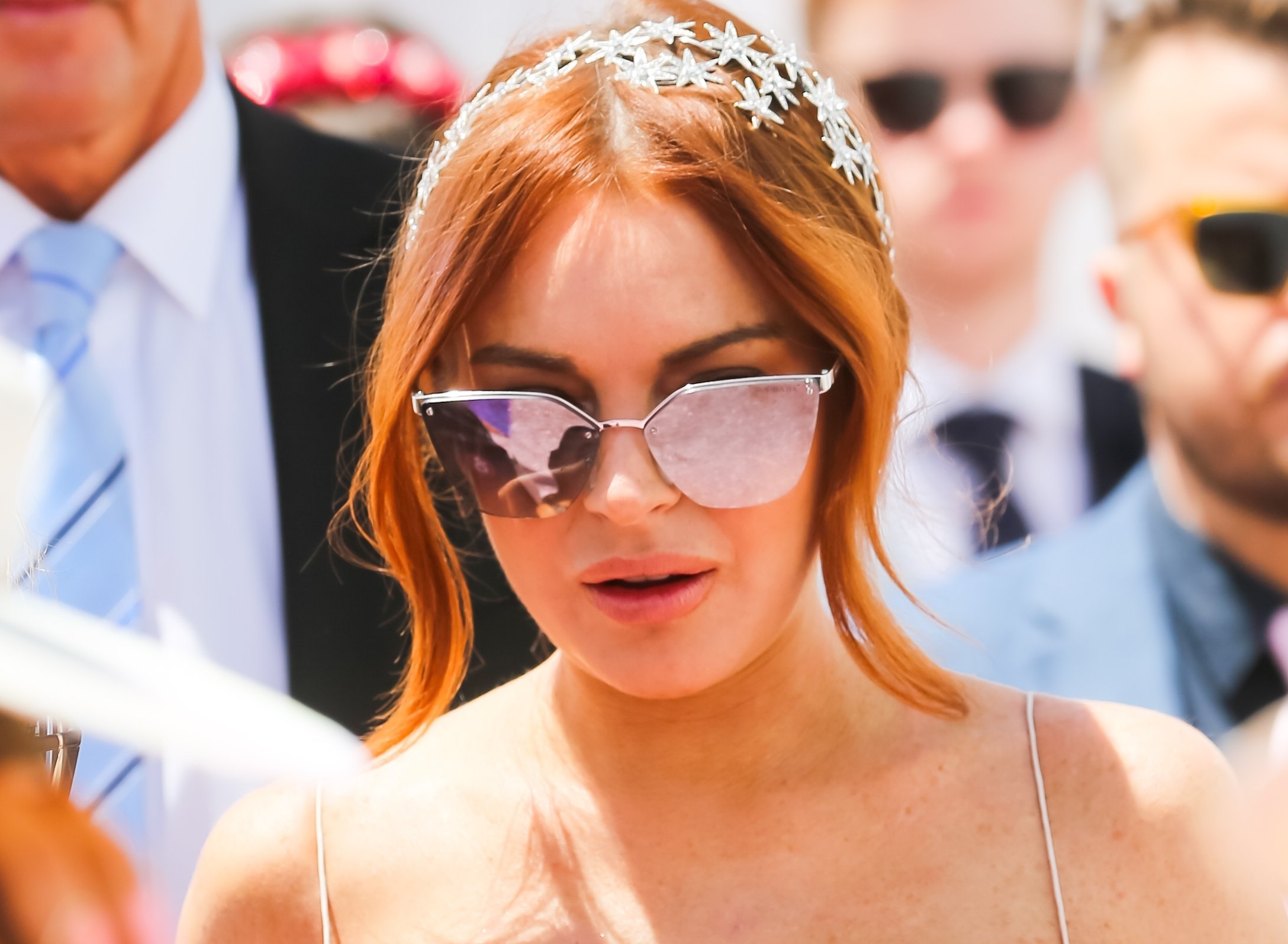 Lindsay Lohan on Lexus Melbourne Cup Day at the 2019 Melbourne Cup Carnival at Flemington Racecourse in Melbourne Australia in white dress and sunglasses