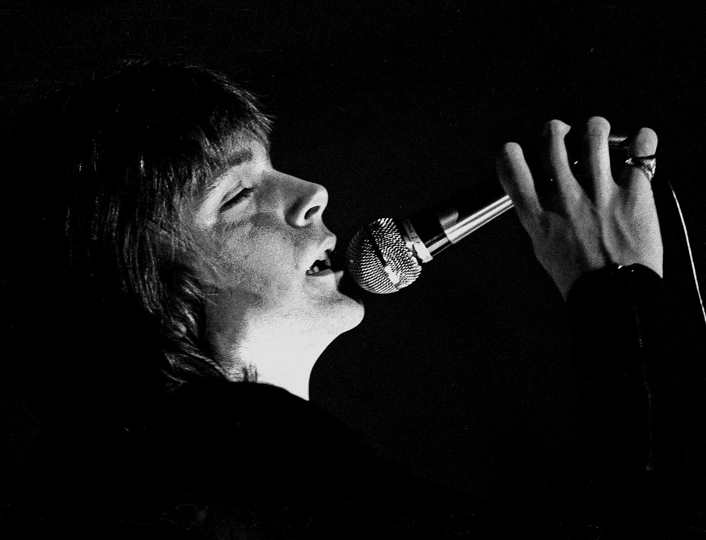 David Cassidy performing live on stage on a black background - 1973