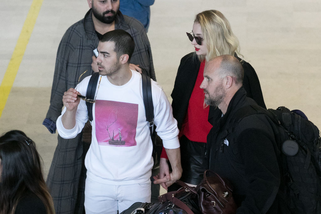 Singer Joe Jonas and actress Sophie Turner arrive at Aeroport